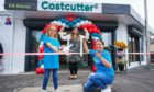 Madison Martin, 9, with shop owner Anila Anwar and mum Samantha Kirk, at the grand-opening of the newly refurbished Costcutter store in St Andrews.