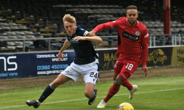 Max Anderson takes on Charles Dunne against St Mirren.