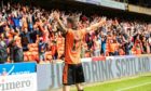 Dundee United left-back Jamie Robson celebrates after netting the winner against Rangers.