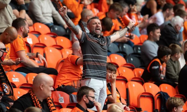 That's one happy Arab as Dundee United beat Rangers 1-0 at Tannadice.