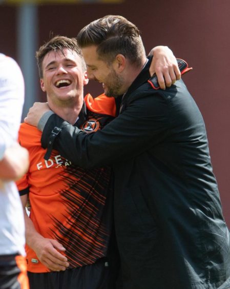 Match-winner Jamie Robson (left) and Dundee United boss Tam Courts celebrate at full time.