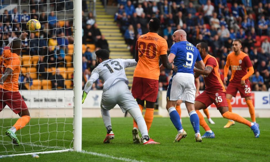 Ismail Cipe spills into his own net under pressure from Kane