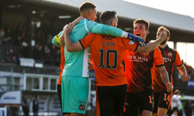 Goalkeeper Benjamin Siegrist and Nicky Clark were the Dundee United heroes.