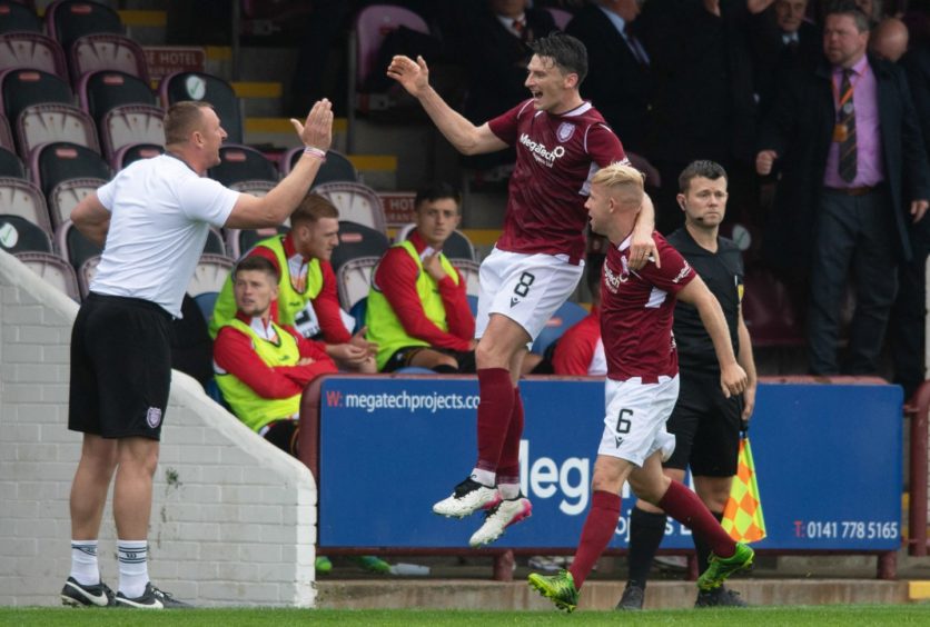 Michael McKenna's celebrates his double against Partick Thistle at Gayfield.