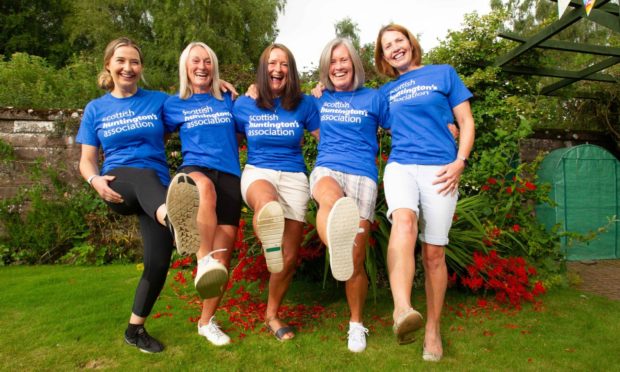 Claire Dyce, Gill Ferguson, Jennifer Paton, Dianne Scott and Susan Dyce celebrate their Three Peaks success. Pic: Paul Reid