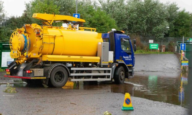 Work to clear the water at Riverside Recycling Centre.