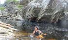 Gayle Ritchie enjoys a wild swim in a natural pool at Alladale Wilderness Reserve in Sutherland.