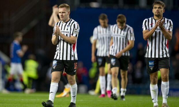 Dejected: Pybus acknowledges the Pars faithful at Ibrox
