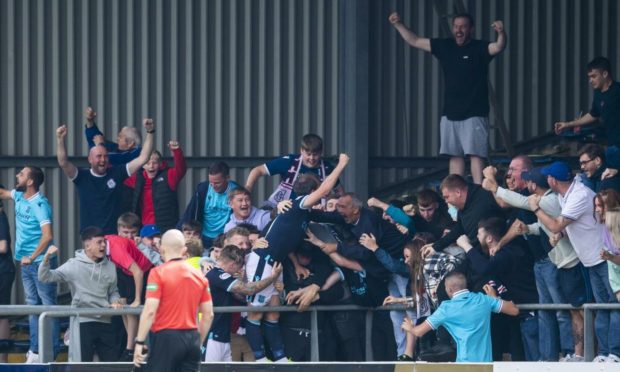 Paul McGowan celebrates in the South Enclosure.