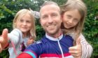 Nathan Grove with daughters Abigail, 7, and Madeline, 9. Angus. Supplied by Nathan Grove.