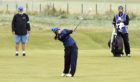 Kelsey MacDonald hits into the 18th green in the first round at Carnoustie.