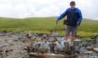 Gary Nelson at wreckage of the Vickers Wellington bomber near Muckle Cairn, Glen Clova.
