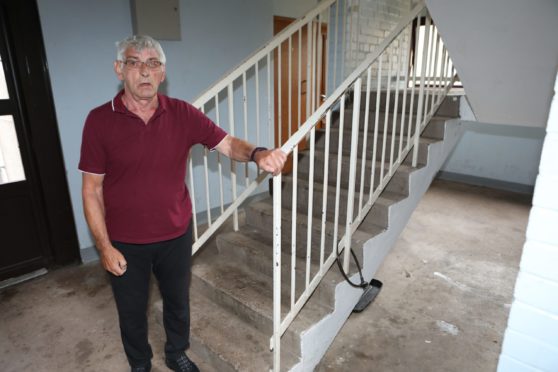 Gordon Archibald at the Forfar stairwell where a motorbike was padlocked. Pic: Gareth Jennings/DCT Media