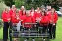 Montrose Town Band members at the memorial bench to legendary bandmaster James Easton