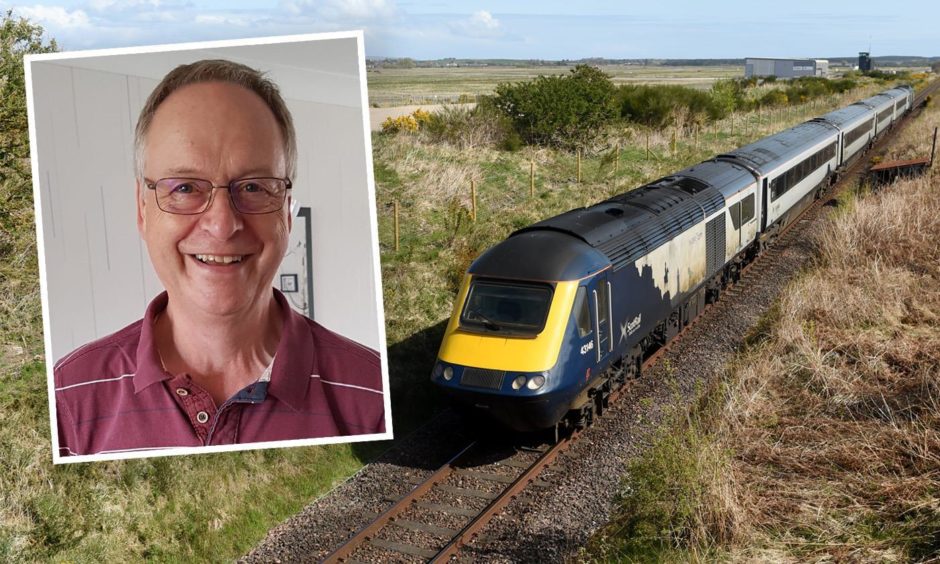 Ian Budd and a train on the Inverness to Aberdeen line