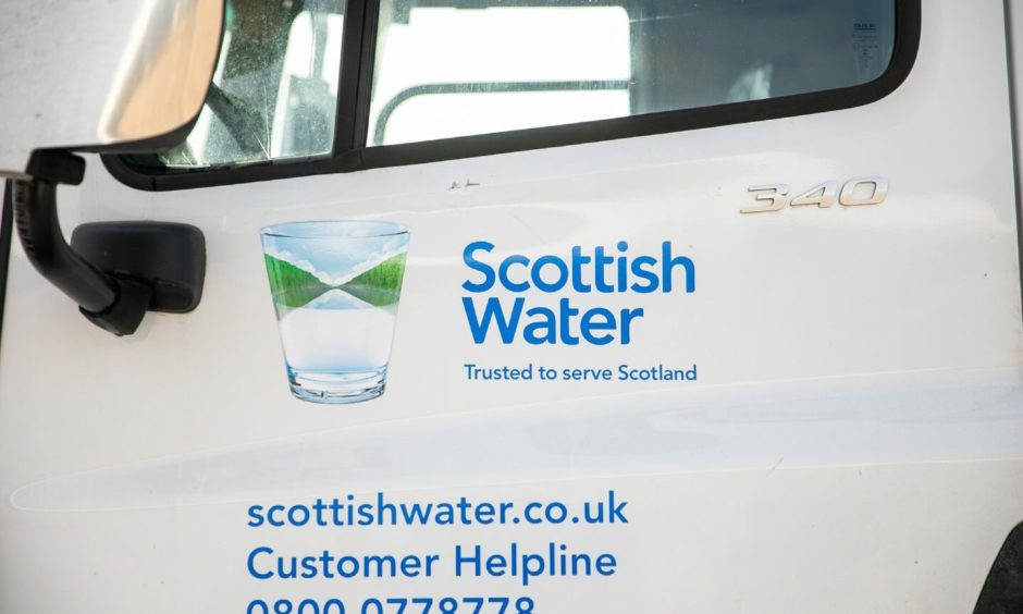 Scottish water van with the company's logo 'Scottish Water, trusted to serve Scotland' on the side.
