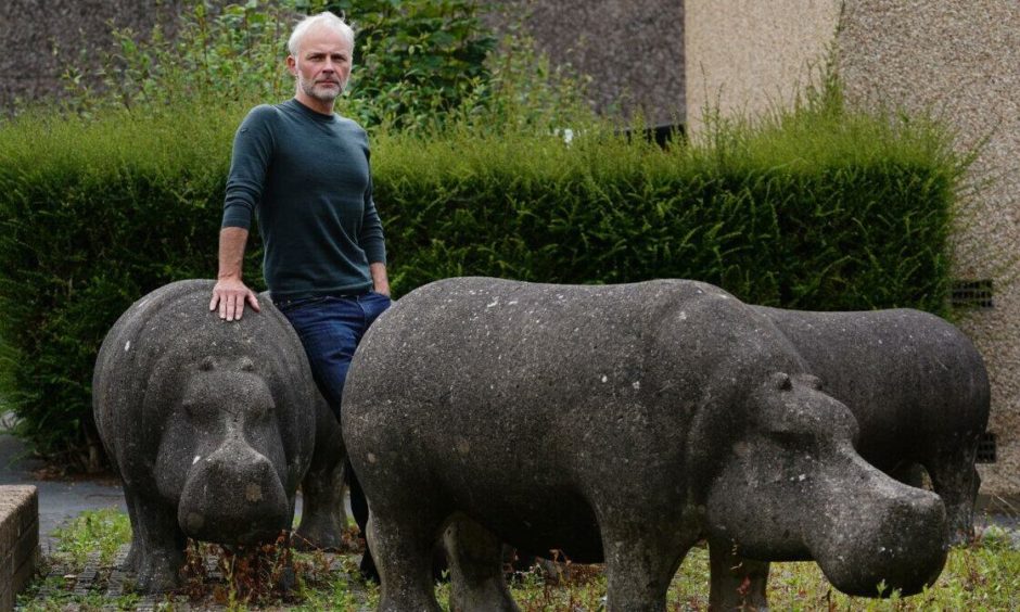Mark Bonnar poses with a herd of hippos in Glenrothes