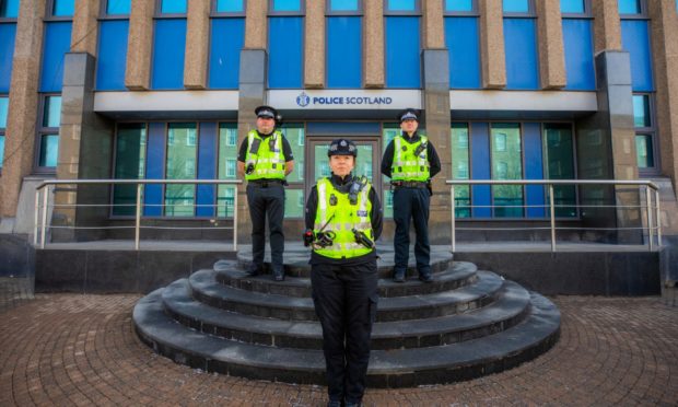 Officers outside Police Scotland Tayside Division HQ, West Bell Street, Dundee