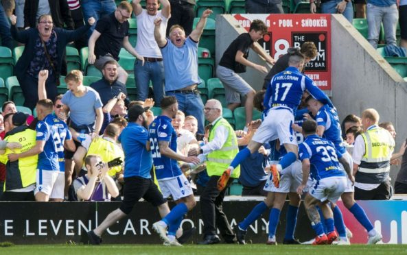 The St Johnstone players and fans celebrating a goal in a match vs Hibs back in August 2019.