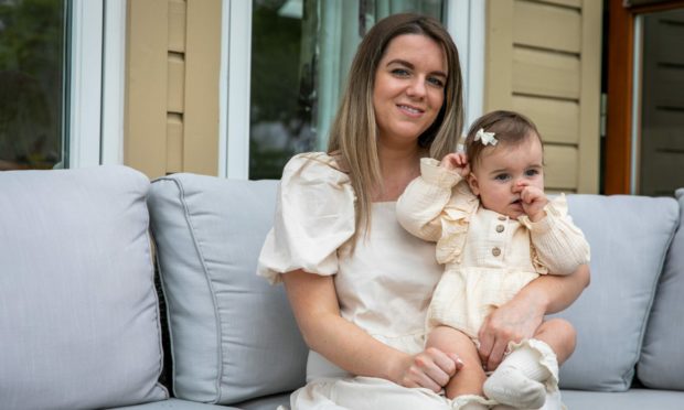 Amanda Cramb with her daughter Annie, who inspired her to start online baby shop Annie's Accessories.