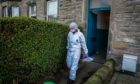 Police working at the site of Mr Stoica's death in David Street, Kirkcaldy