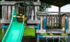 The damaged play equipment.
