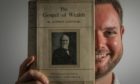 Joe Whiteman with one of Andrew Carnegie's books.