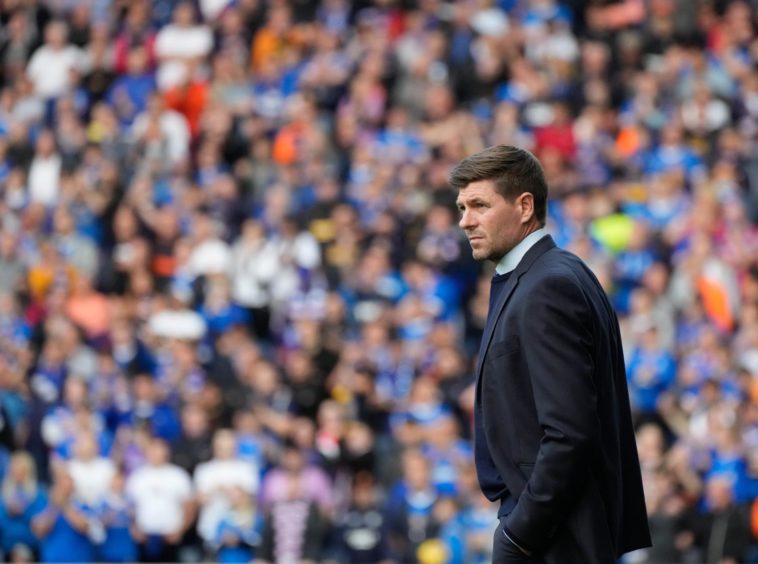 A despondent Gerrard watches Rangers lose out to Malmo