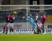 Dundee goalkeeper Jack Hamilton makes a diving save to deny Jason Thomson of Arbroath.