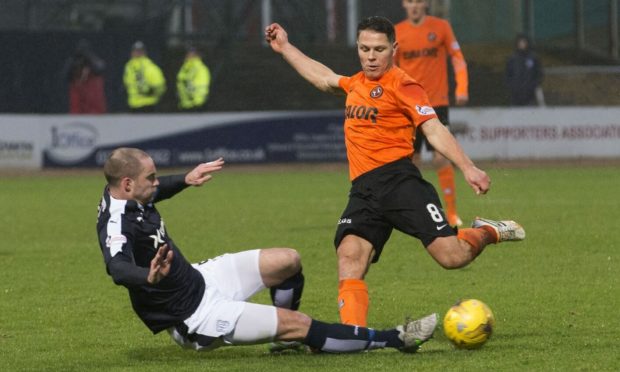 James McPake challenges John Rankin in the 2016 New Year's Dundee derby - the moment which ended his playing career.