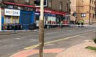 A police cordon is in place at Hilltown, near to the junction with Constitution Street.