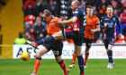Dundee United's Peter Pawlett competes with Ross County's Kenny van der Weg.