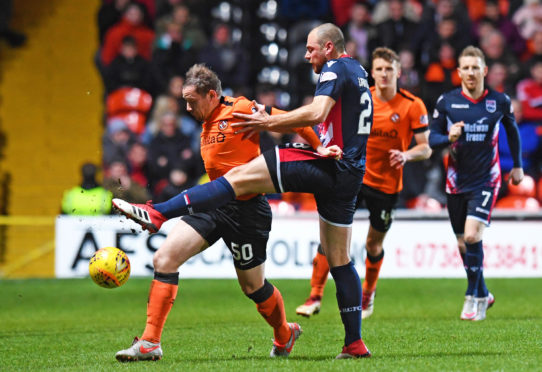 Dundee United's Peter Pawlett competes with Ross County's Kenny van der Weg.