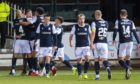 Dundee players celebrate the opening goal against Hearts.