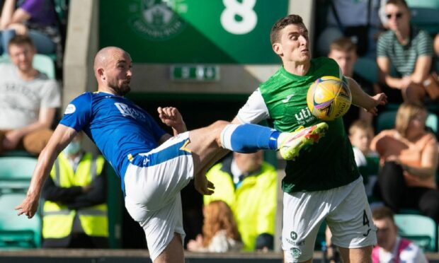 Hibs' Paul Hanlon and St Johnstone's Chris Kane in action.