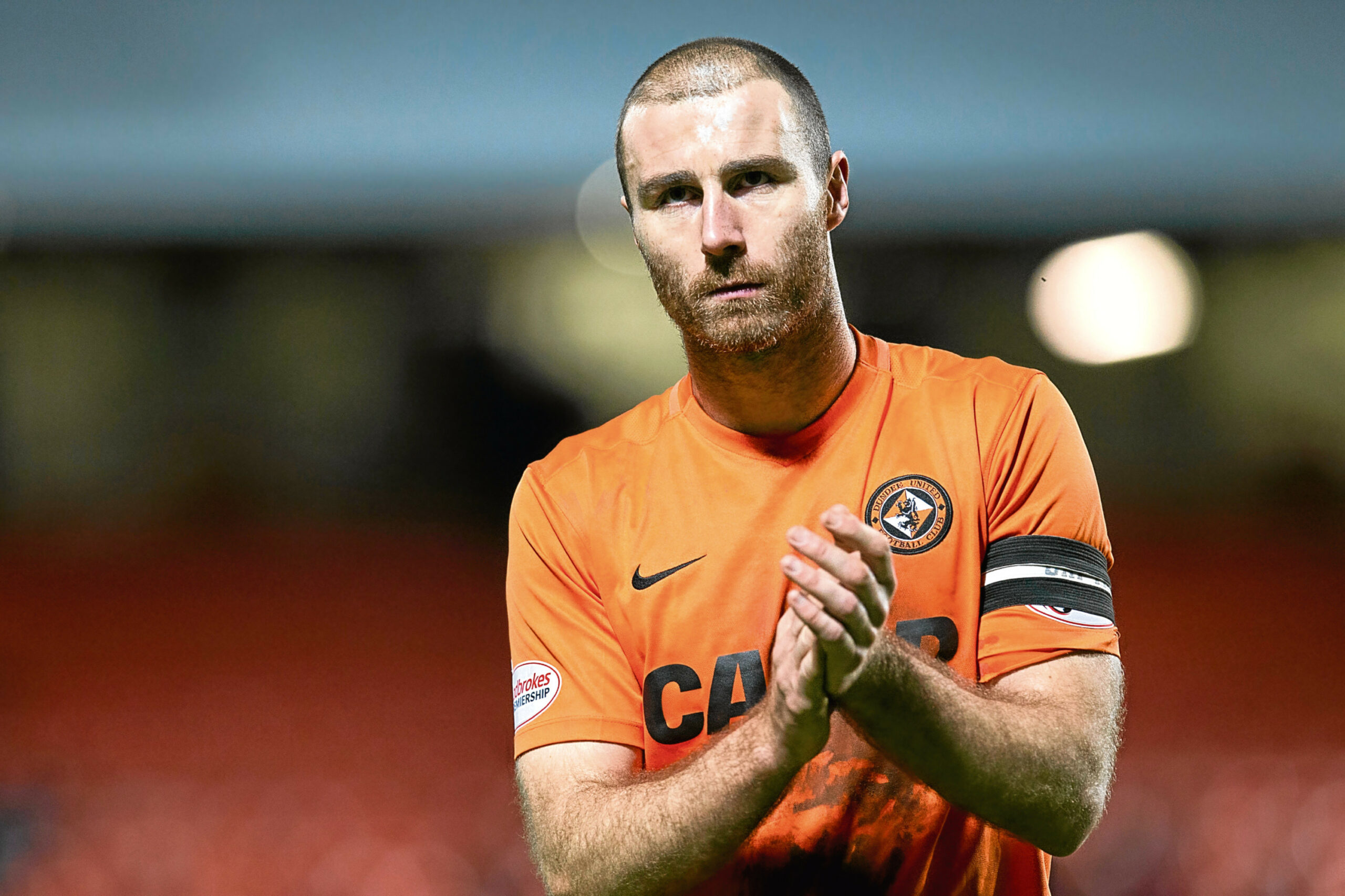 Dundee United's Sean Dillon applauds the home support at the full time whistle of January's clash with Kilmarnock