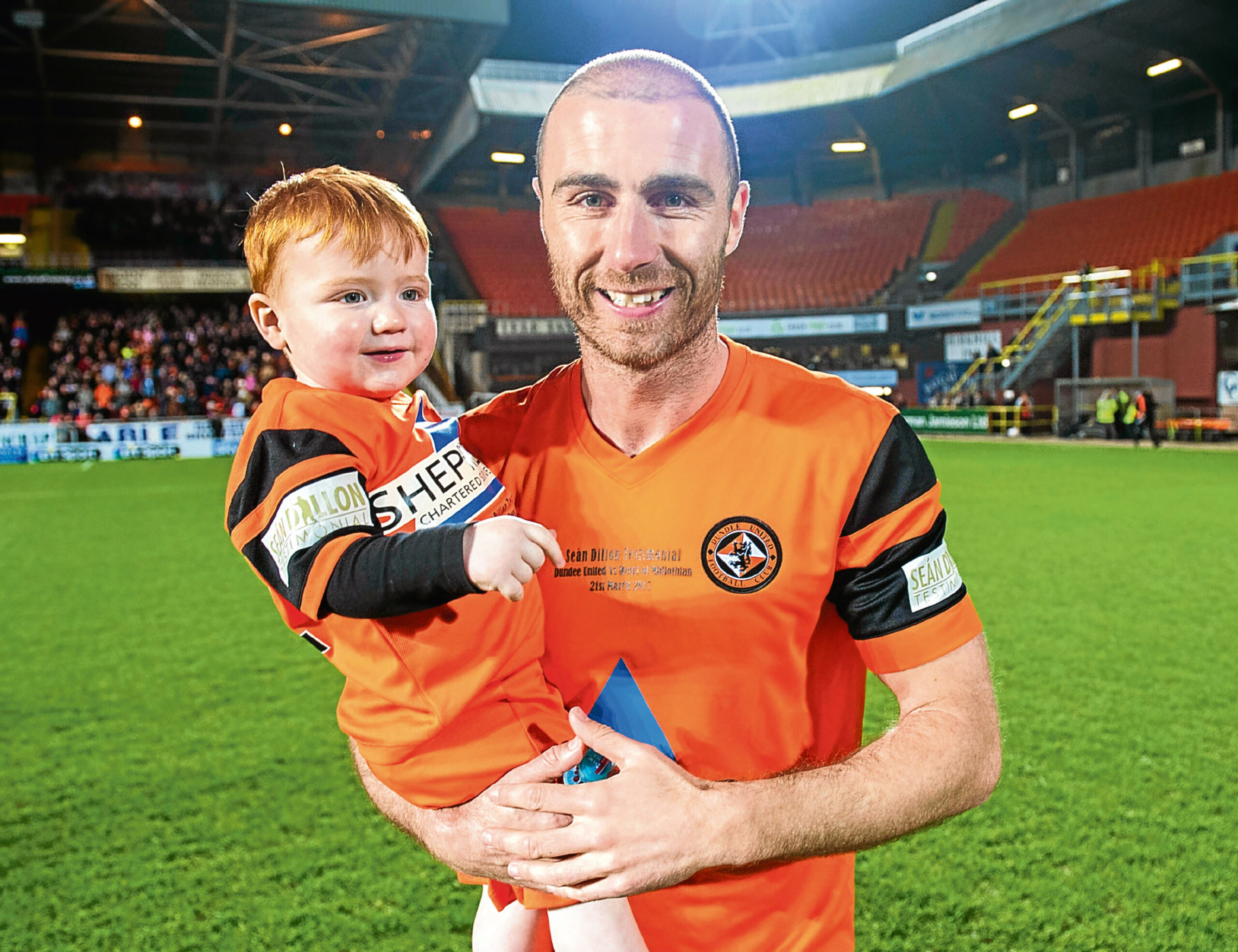 Dillon with his son Finn at his testimonial in March