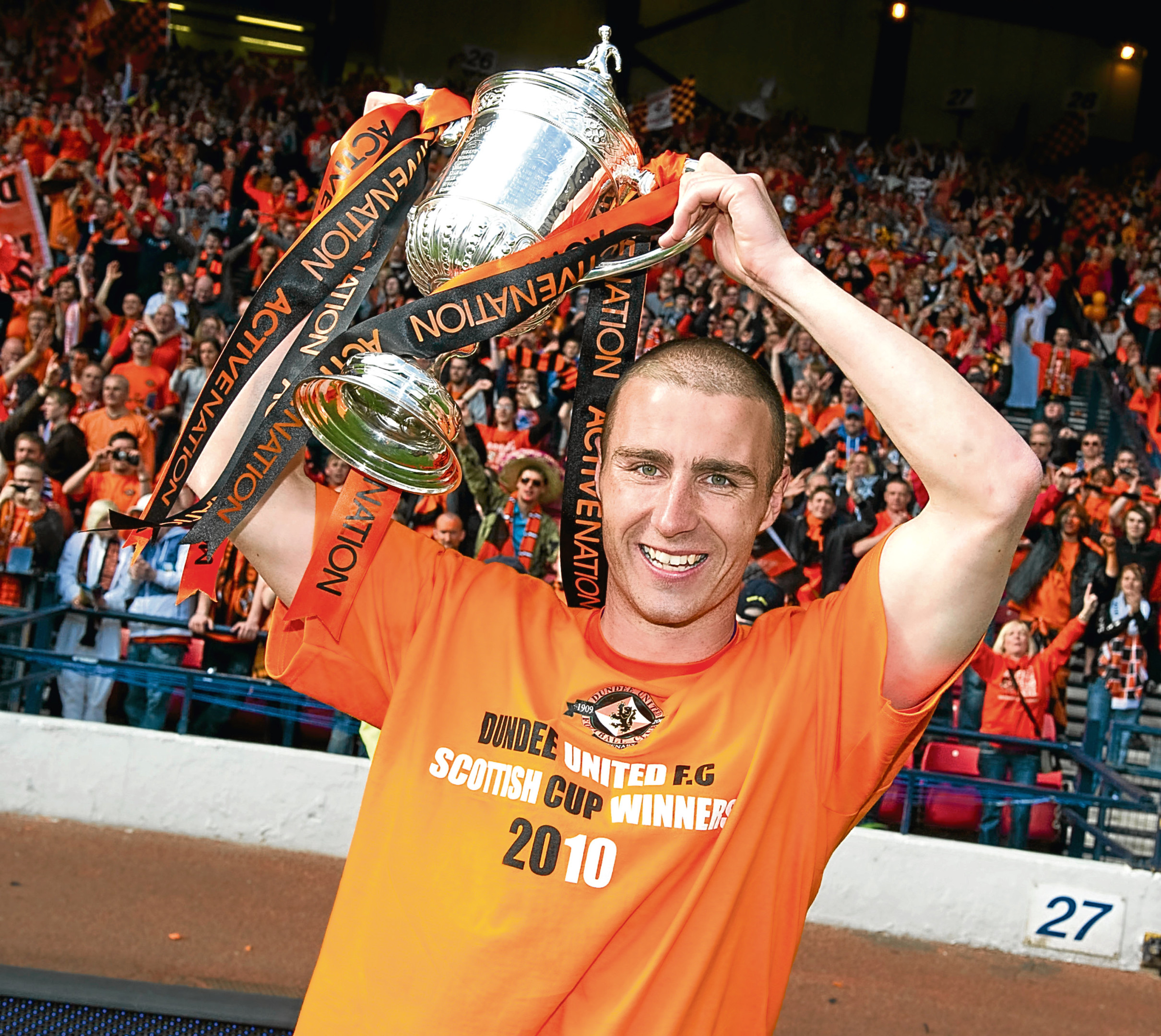 Dillon lifts the Scottish Cup after a 3-0 win over Ross County in 2010