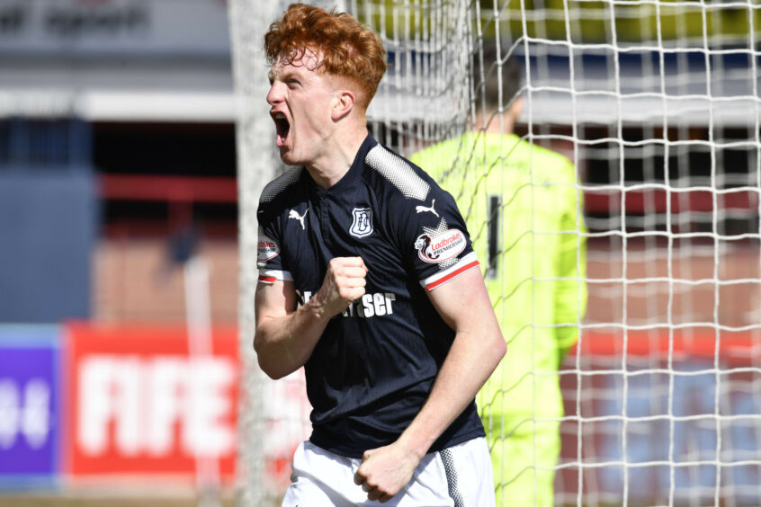 Simon Murray enjoys a Dens Park goal. Image: SNS