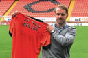 New Dundee United manager Robbie Neilson reckons he has become a better manager for his time in England with MK Dons.