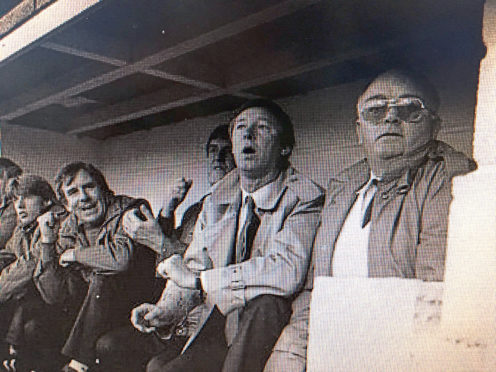 Sir Alex Ferguson's first game in charge of Man United in 1985. The person on his left is said to be the team bus driver