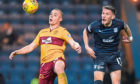 The Dark Blues’ Andy Dales battles with Motherwell’s Liam Grimshaw in the 1-0 defeat at Dens Park on Saturday