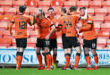 Calum Butcher (right) is congratulated by his team-mates after firing Dundee United ahead.