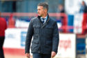 Dundee manager Jim McIntyre trudges off the field following relegation from the Ladbrokes Premiership