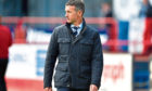 Dundee manager Jim McIntyre trudges off the field following relegation from the Ladbrokes Premiership