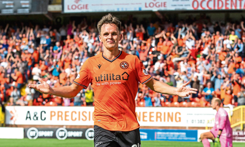 Lawrence Shankland celebrating with Dundee United fan