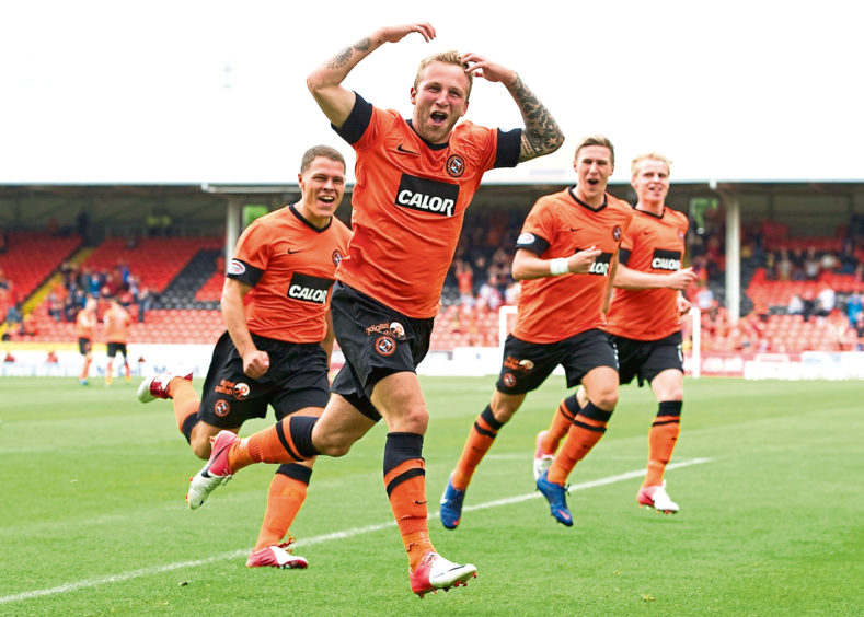 Johnny Russell leads the celebrations during his days at Tannadice.