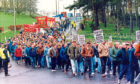 Strike supporters sweep down the Timex brae, placards in hand in 1993.