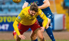 Christophe Berra and Dario Zanatta in action during the Dundee vs Partick Thistle tie on February 8.