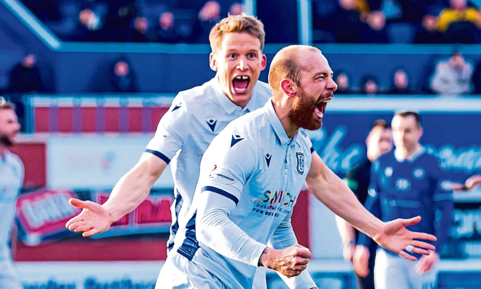 Christophe Berra rushes to congratulate Jordan Forster after his goal against Queen of the South.